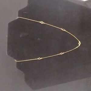 Gold chain with 5 round purple crystals